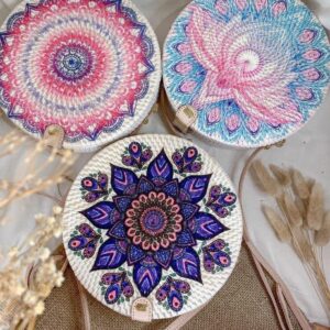 Handcrafted Bali Rattan Bags featuring Intricate Mandala and Floral Artwork.